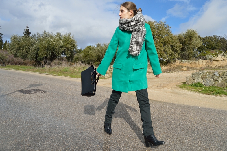 Green coat over black look