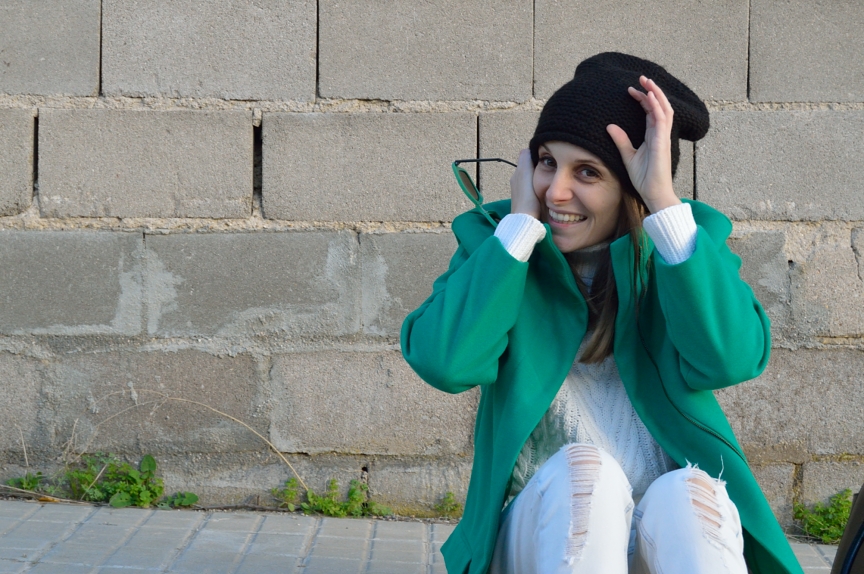 All in white and a green coat